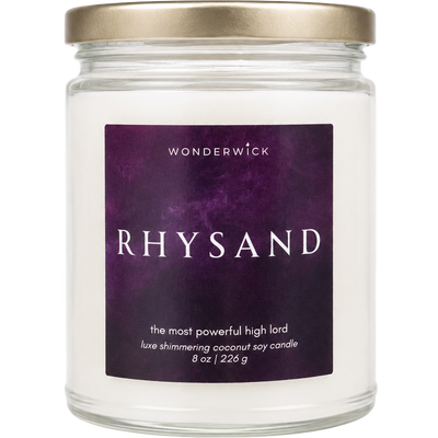 Wonderwick Rhysand coconut soy candle in a glass jar with gold lid and deep purple label