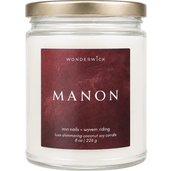 Wonderwick Manon coconut soy candle in a glass jar with gold lid, iron nails and wyvern riding scent