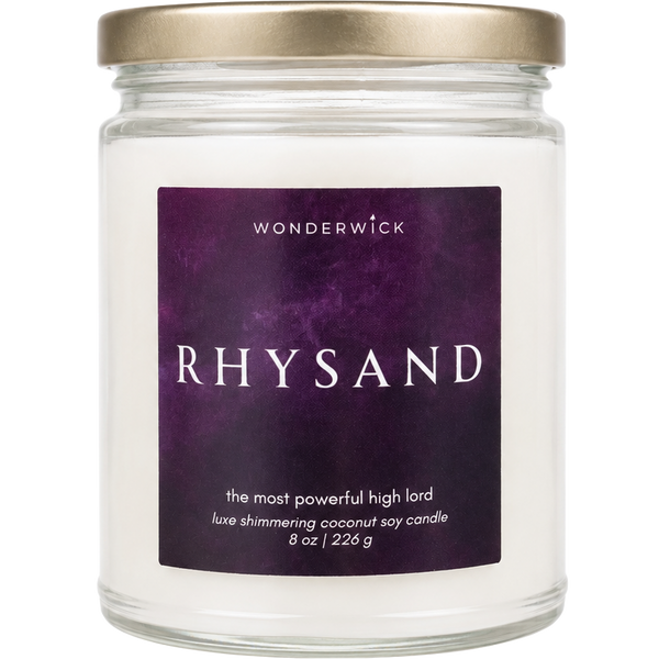 Wonderwick Rhysand coconut soy candle in a glass jar with gold lid and deep purple label